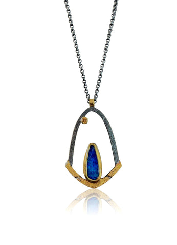 Long curved wiggly pendant with blue topaz & 18K gold detail