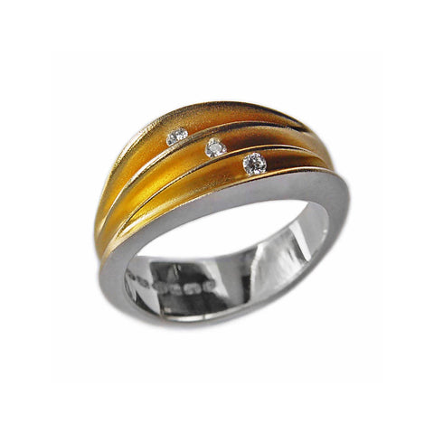 Partially split silver shell ring with 10pt diamond and 22k gold plated interior