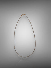 White Diamond Tube Bead Necklace with Gold Accents