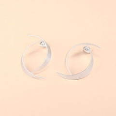 Sleek Swirl Crossing Silver Hoop Earrings