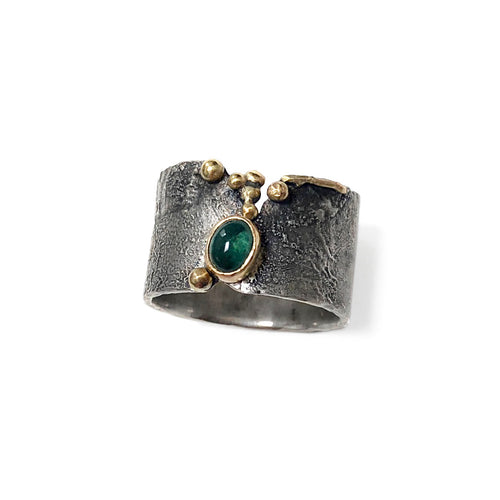 Oval Green Tourmaline in 18k gold bezel on Reticulated Oxidized Silver ring