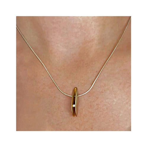 Front silver shell diamond pendant with 22K gold plated interior