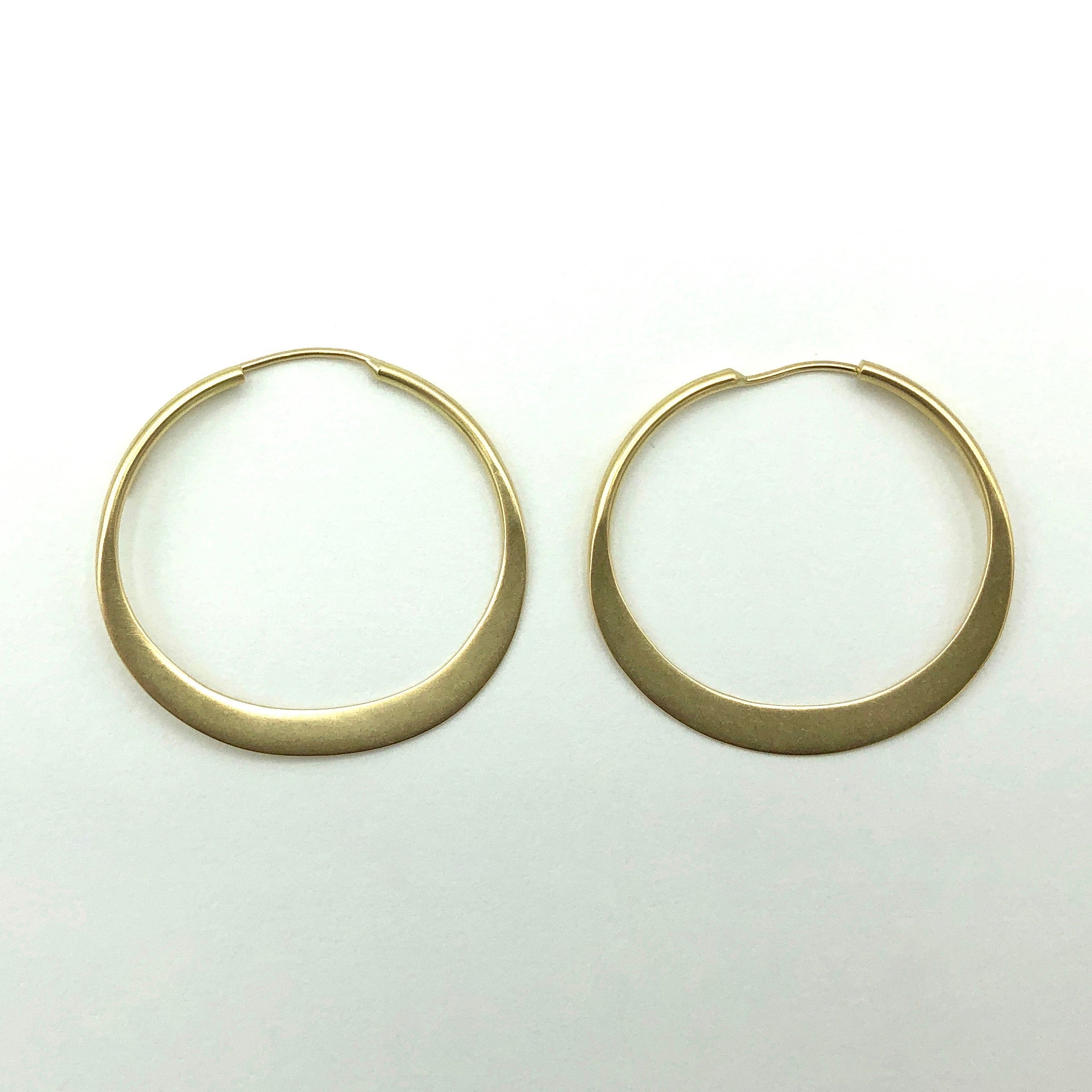 Hand-forged gold hoops