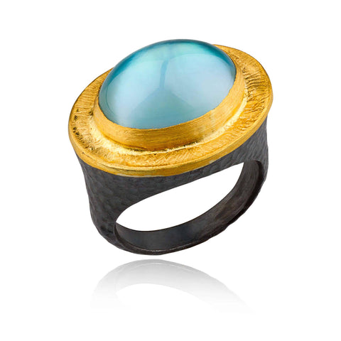 Double taper silver wiggly ring with blue topaz