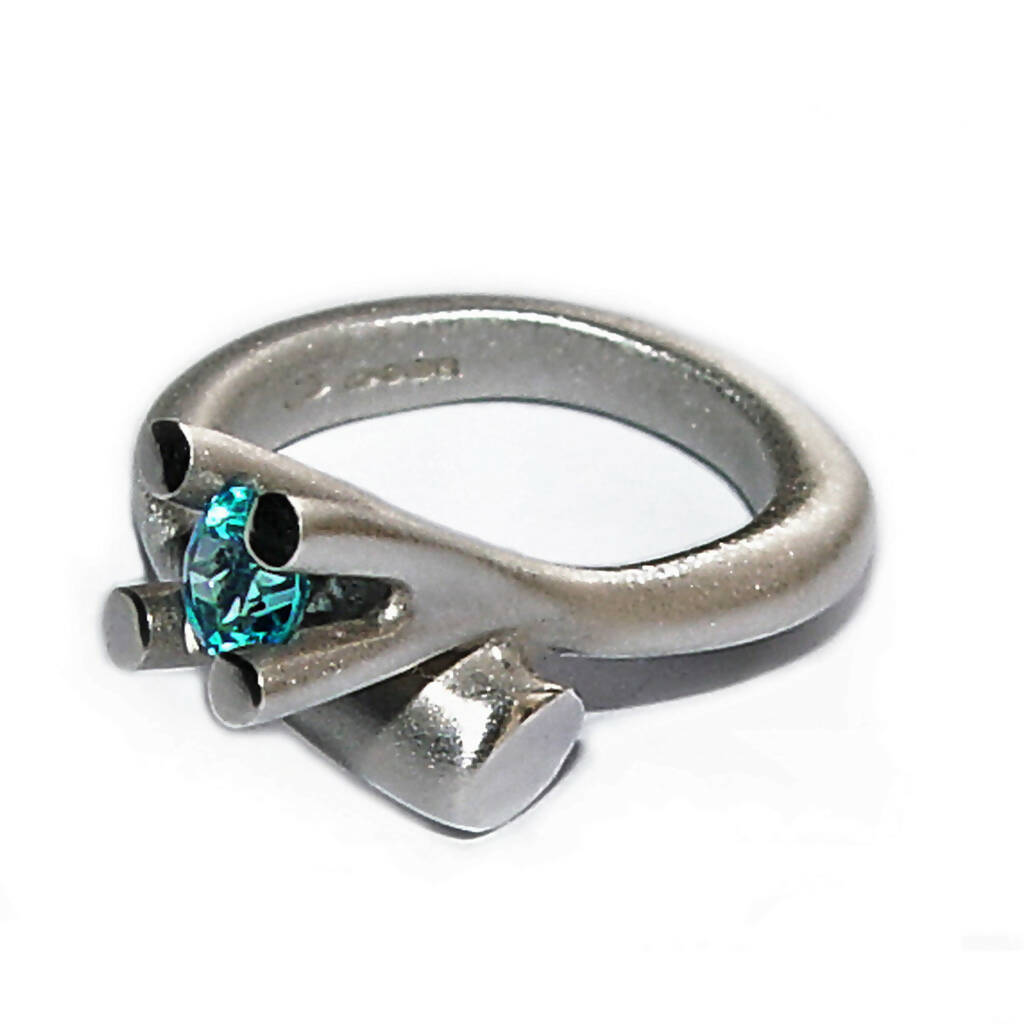 Tapering silver bough ring with blue topaz